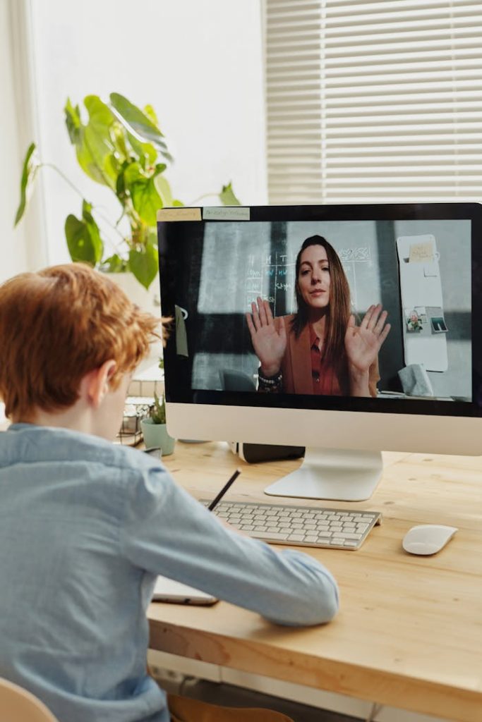 photo-of-boy-video-calling-with-a-woman-through-imac-4145196 Photo of Boy Video Calling With a Woman Through Imac